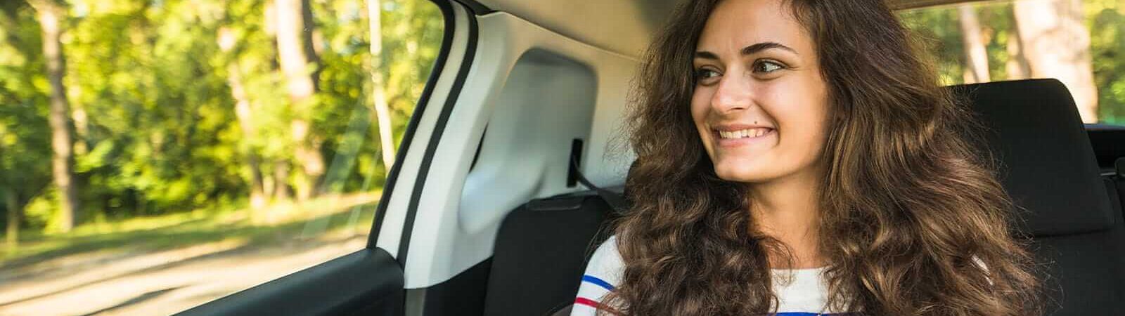 Young woman car trip